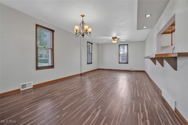 2000 Henry Ave SW, Canton, OH 44706 - unfurnished living room featuring a chandelier, wood finished floors, baseboards, recessed lighting, and a ceiling fan