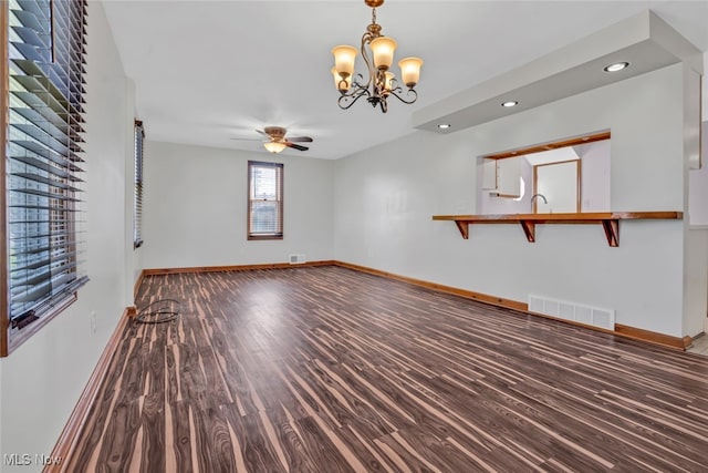 2000 Henry Ave SW, Canton, OH 44706 - empty room with wood finished floors, a ceiling fan, baseboards, a chandelier, and recessed lighting