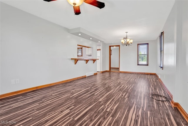 2000 Henry Ave SW, Canton, OH 44706 - unfurnished living room with dark wood-style floors, baseboards, a chandelier, and recessed lighting