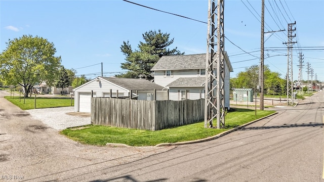 2000 Henry Ave SW, Canton, OH 44706 - view of property exterior with a garage and gravel driveway