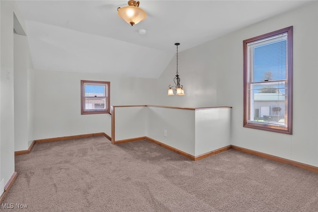 2000 Henry Ave SW, Canton, OH 44706 - carpeted empty room featuring a chandelier, baseboards, and lofted ceiling