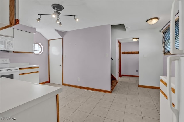 2000 Henry Ave SW, Canton, OH 44706 - kitchen featuring white appliances, light countertops, baseboards, and light tile patterned flooring