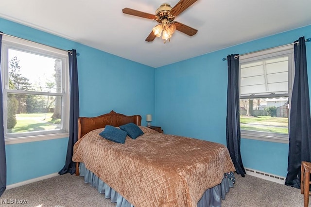 7101 Reynolds Rd, Mentor, OH 44060 - bedroom with baseboard heating, multiple windows, and carpet flooring