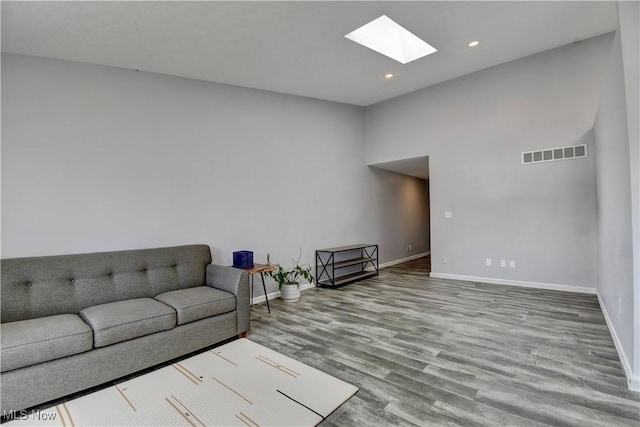 213 Knollton Dr, Millersburg, OH 44654 - living area with a skylight, baseboards, wood finished floors, and recessed lighting