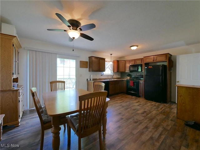 333 Mulberry St, Barnesville, OH 43713 - dining room featuring a ceiling fan and dark wood-type flooring