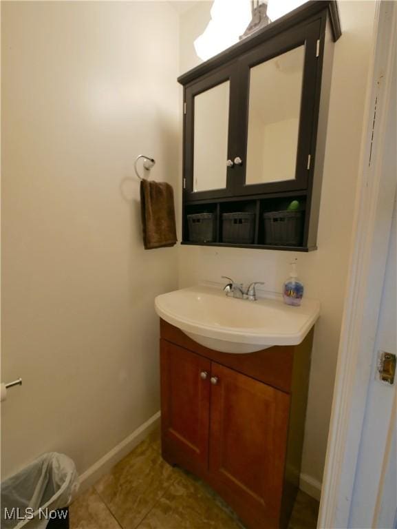333 Mulberry St, Barnesville, OH 43713 - bathroom with vanity, baseboards, and tile patterned flooring