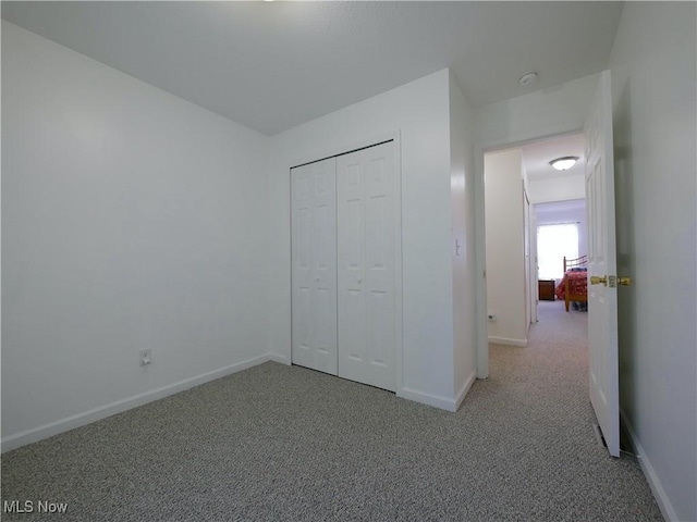 333 Mulberry St, Barnesville, OH 43713 - unfurnished bedroom featuring carpet, baseboards, and a closet