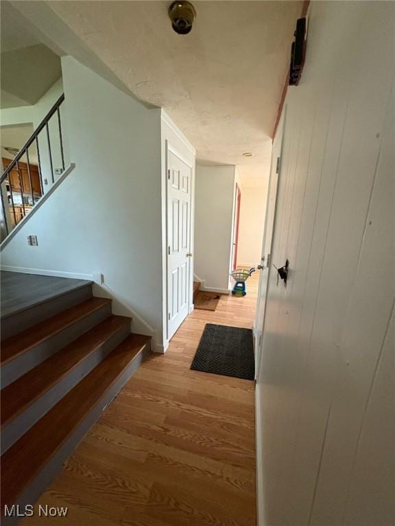 4222 Kenyon Ct, Lorain, OH 44053 - staircase with wood finished floors and baseboards