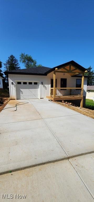 1404 15th St, Vienna, WV 26105 - view of front of house with concrete driveway and a garage