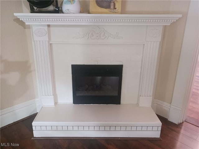 636 4th St, Marietta, OH 45750 - detailed view of a tiled fireplace and wood finished floors