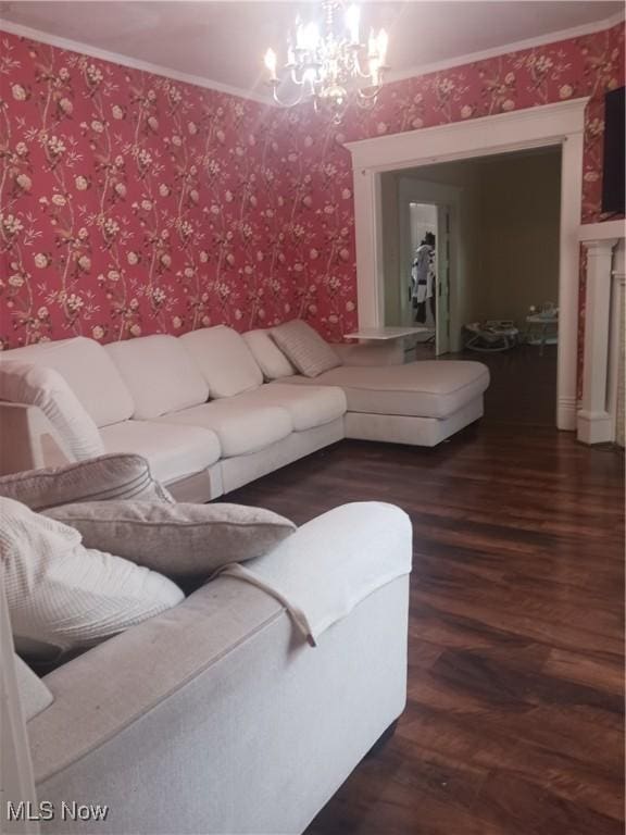 636 4th St, Marietta, OH 45750 - living room with a chandelier, wood finished floors, and wallpapered walls