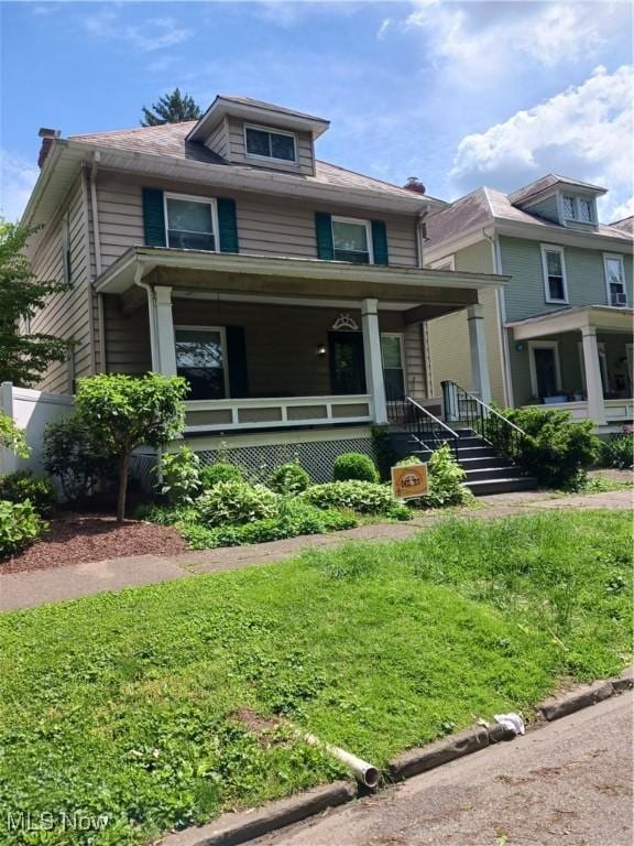 636 4th St, Marietta, OH 45750 - traditional style home featuring covered porch and a front yard