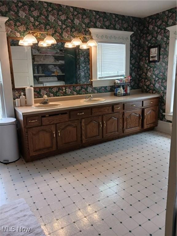 636 4th St, Marietta, OH 45750 - bathroom with wallpapered walls, tile patterned floors, and double vanity