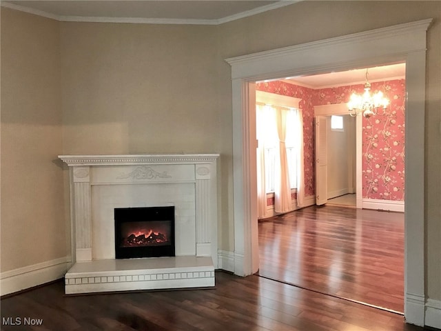 636 4th St, Marietta, OH 45750 - detailed view of wood finished floors, a chandelier, a lit fireplace, crown molding, and baseboards