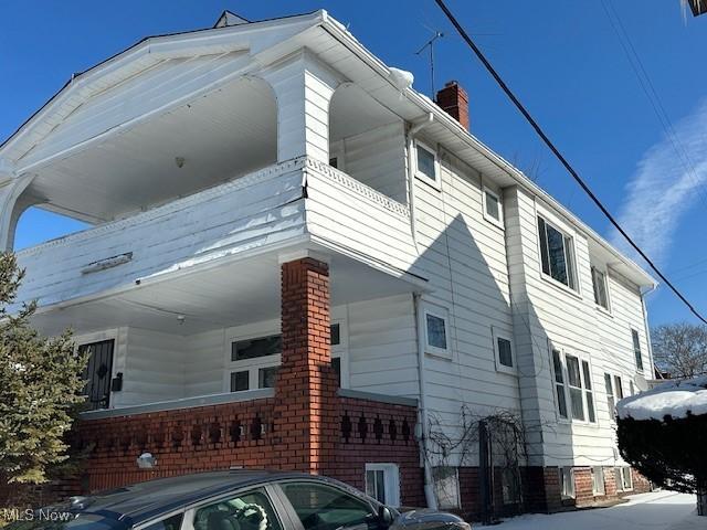 view of side of home with a chimney