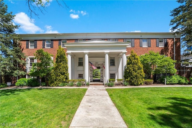 19901 Van Aken Blvd Unit 7, Shaker Heights, OH 44122 - view of front of home featuring a front lawn, covered porch, and brick siding