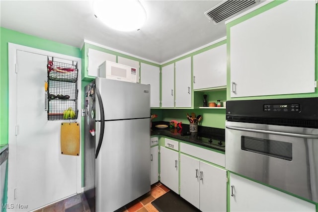 19901 Van Aken Blvd Unit 7, Shaker Heights, OH 44122 - kitchen featuring stainless steel appliances, white cabinetry, open shelves, and dark countertops