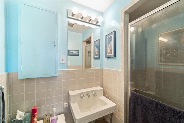 19901 Van Aken Blvd Unit 7, Shaker Heights, OH 44122 - full bathroom featuring a stall shower, tile walls, and wainscoting