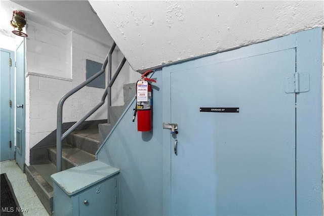 19901 Van Aken Blvd Unit 7, Shaker Heights, OH 44122 - stairway featuring concrete block wall