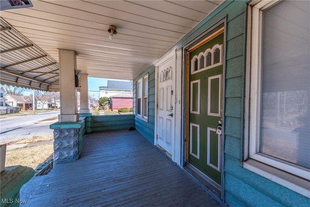 wooden terrace featuring a porch
