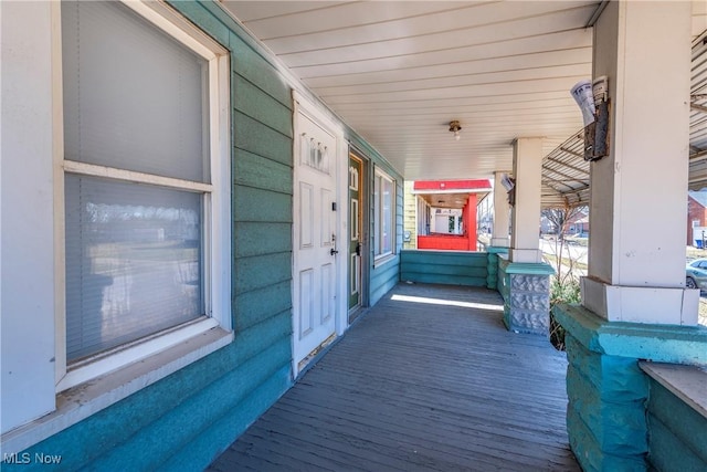wooden deck featuring a porch