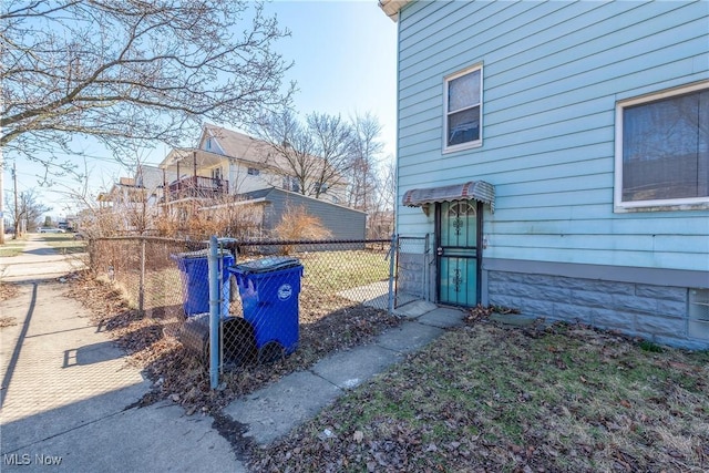 view of property exterior featuring fence
