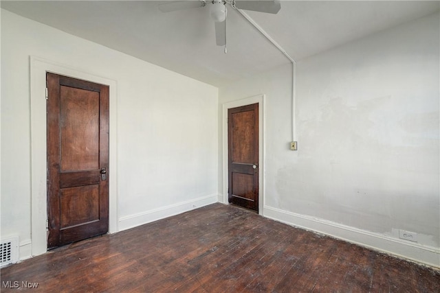 empty room with hardwood / wood-style flooring, baseboards, and ceiling fan