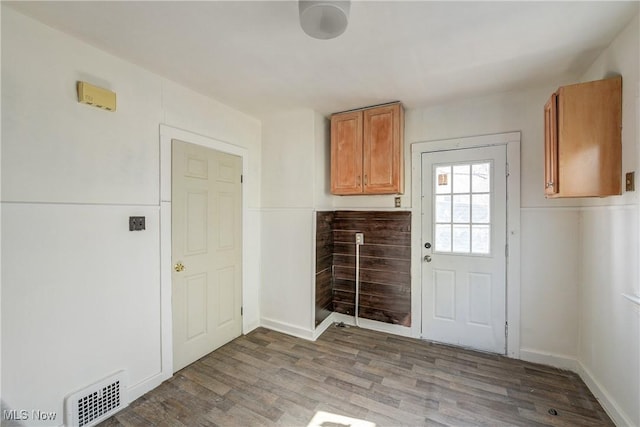 washroom with wood finished floors