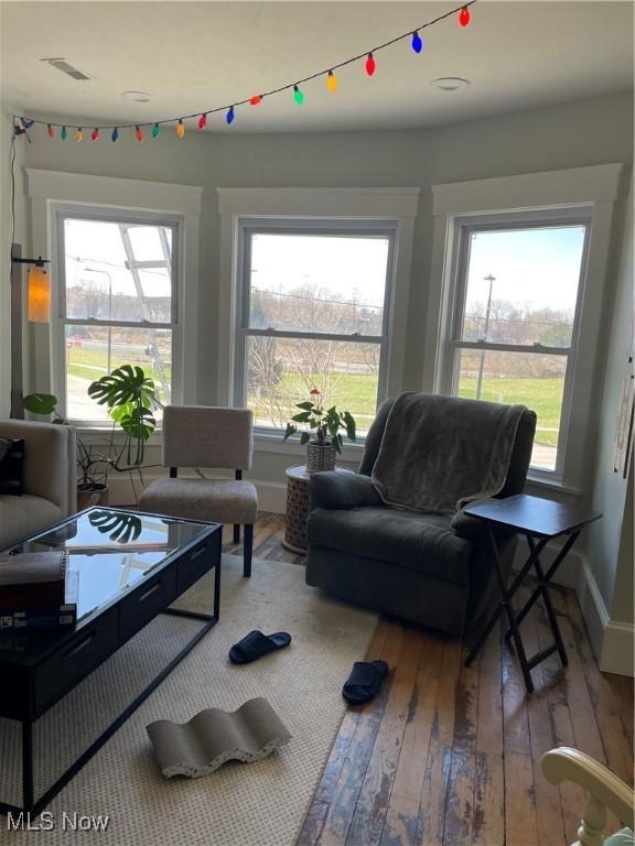 3217 W 14th St, Cleveland, OH 44109 - living room with wood-type flooring, healthy amount of natural light, and baseboards
