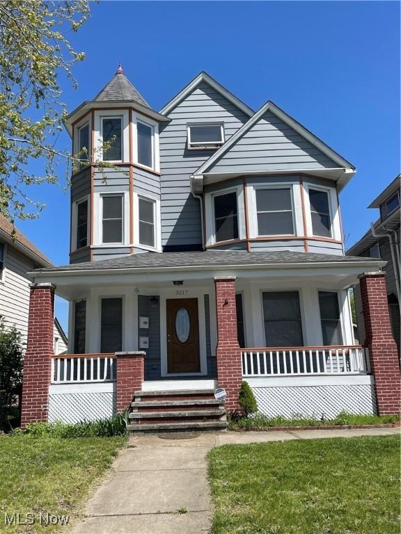 3217 W 14th St, Cleveland, OH 44109 - victorian-style house featuring a porch