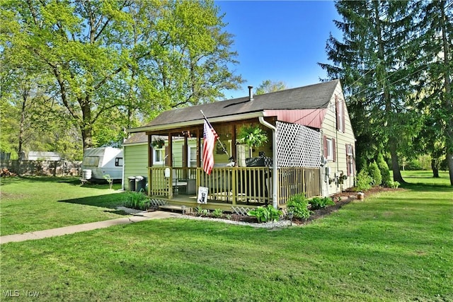 3122 Mccleary Jacoby Rd, Cortland, OH 44410 - view of front of home with a front lawn, covered porch, and a shingled roof