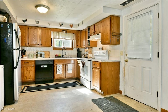 3122 Mccleary Jacoby Rd, Cortland, OH 44410 - kitchen with white electric range oven, freestanding refrigerator, under cabinet range hood, black dishwasher, and a sink