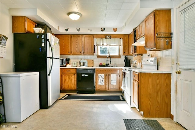 3122 Mccleary Jacoby Rd, Cortland, OH 44410 - kitchen featuring dishwasher, white electric range oven, a sink, brown cabinetry, and decorative backsplash