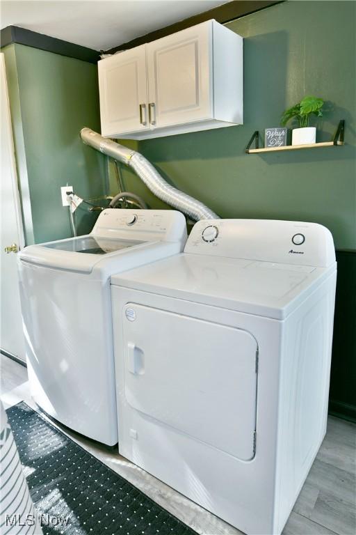 3122 Mccleary Jacoby Rd, Cortland, OH 44410 - clothes washing area with cabinet space and washing machine and clothes dryer