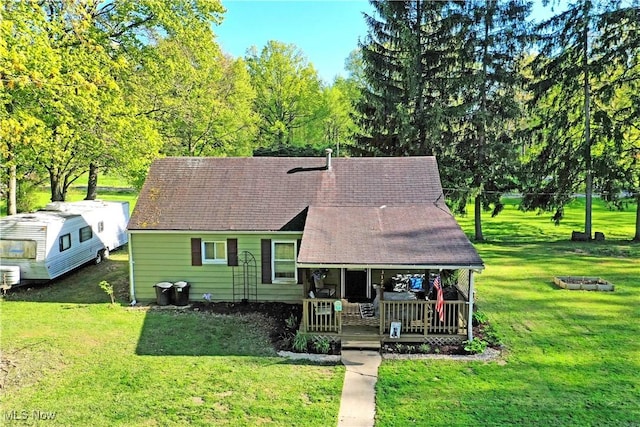3122 Mccleary Jacoby Rd, Cortland, OH 44410 - view of front of property featuring a porch, a front lawn, and roof with shingles