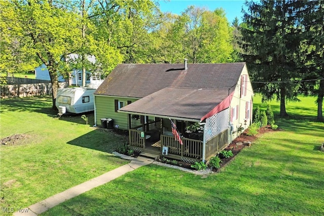 3122 Mccleary Jacoby Rd, Cortland, OH 44410 - view of front of property featuring a front lawn, a shingled roof, and a porch
