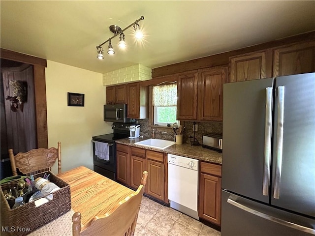 385 Truax Ln, Weirton, WV 26062 - kitchen featuring stainless steel appliances, a sink, tasteful backsplash, light tile patterned flooring, and dark countertops