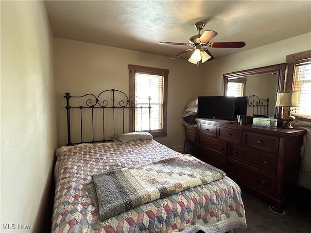 385 Truax Ln, Weirton, WV 26062 - bedroom with dark carpet and a ceiling fan