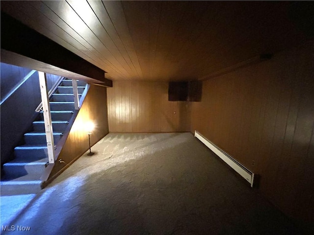 385 Truax Ln, Weirton, WV 26062 - finished below grade area featuring a baseboard heating unit, wood ceiling, wooden walls, carpet, and stairs