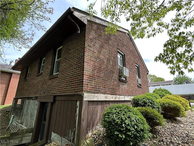 385 Truax Ln, Weirton, WV 26062 - view of property exterior featuring brick siding, fence, and cooling unit