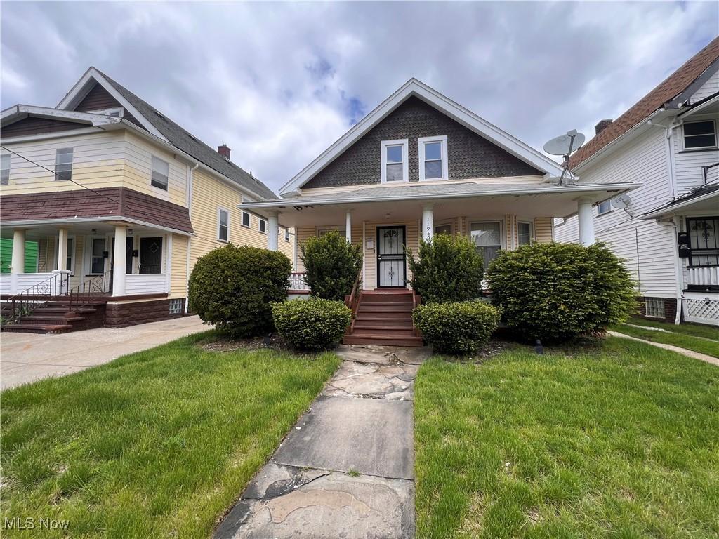 11919 Browning Ave, Cleveland, OH 44120 - bungalow-style home with covered porch and a front yard