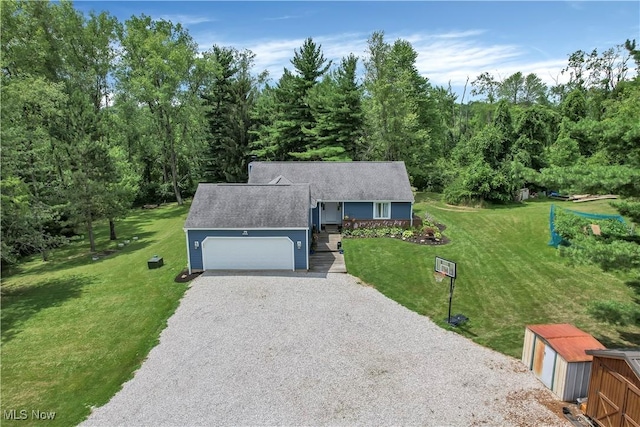 1060 S Watkins Rd, Alexandria, OH 43001 - view of front of home with gravel driveway, a front lawn, and an attached garage