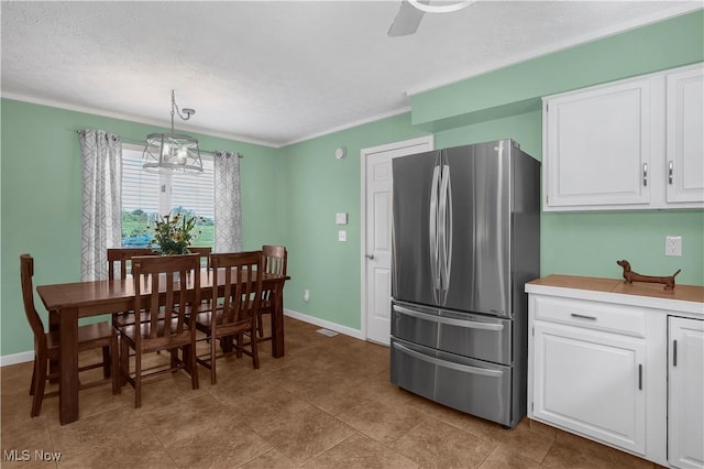 1060 S Watkins Rd, Alexandria, OH 43001 - dining space with baseboards, a textured ceiling, ornamental molding, and a ceiling fan
