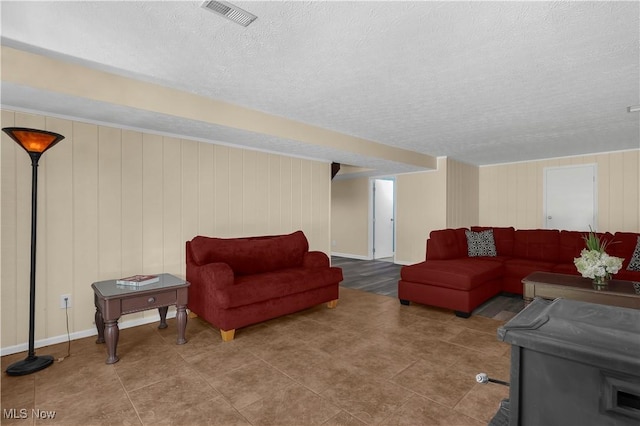 1060 S Watkins Rd, Alexandria, OH 43001 - living area featuring a textured ceiling, baseboards, and tile patterned floors