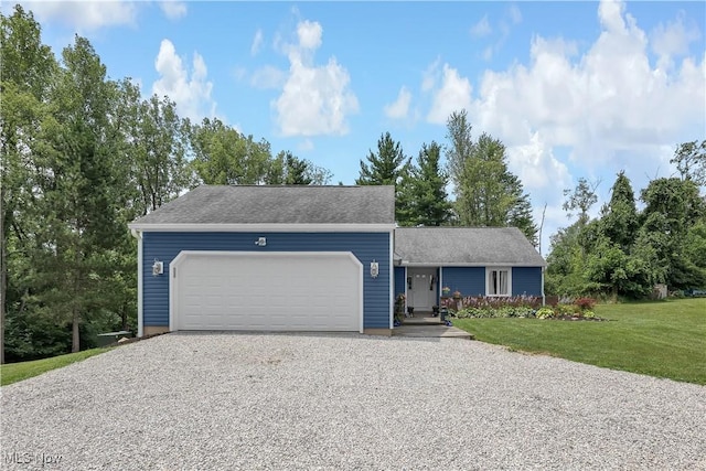 1060 S Watkins Rd, Alexandria, OH 43001 - view of front of property with gravel driveway, a garage, a front lawn, and a porch