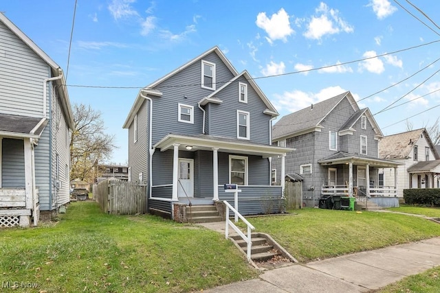 38 W Washington St, Alliance, OH 44601 - view of front of house featuring covered porch and a front lawn