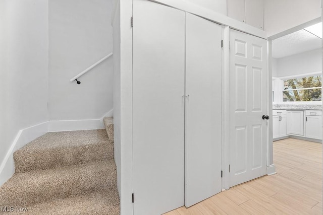 38 W Washington St, Alliance, OH 44601 - staircase featuring wood finished floors