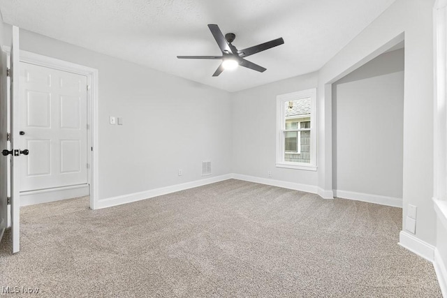 38 W Washington St, Alliance, OH 44601 - carpeted spare room featuring ceiling fan and baseboards