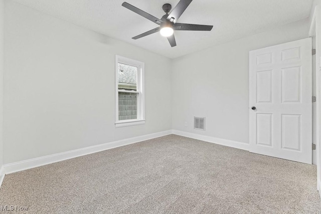 38 W Washington St, Alliance, OH 44601 - carpeted spare room featuring a ceiling fan and baseboards
