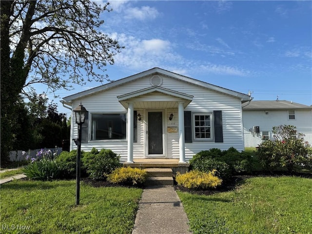 1226 E Main St, Coshocton, OH 43812 - view of front of property featuring a front lawn